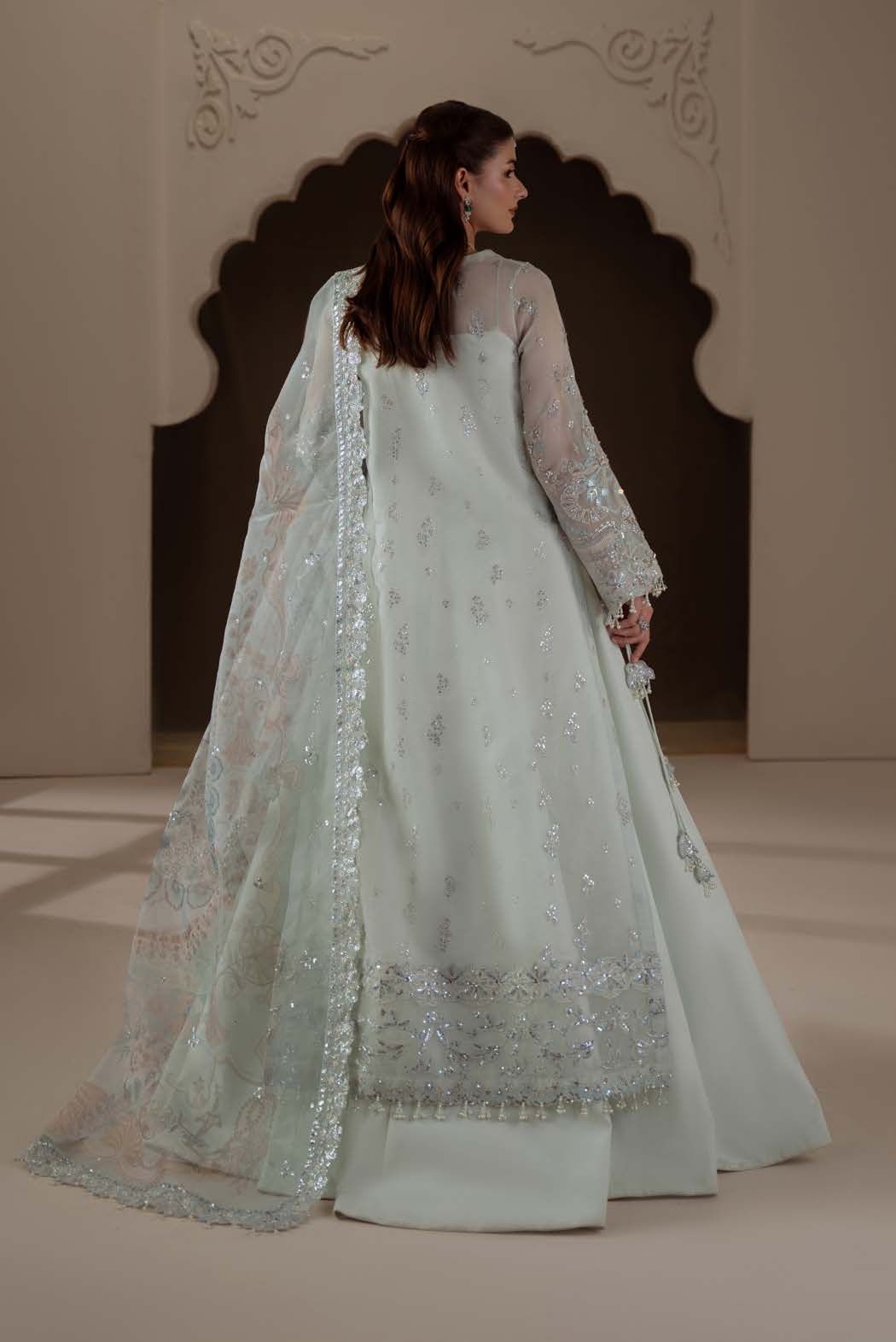 Celeste from behind, with a long sheer dupatta