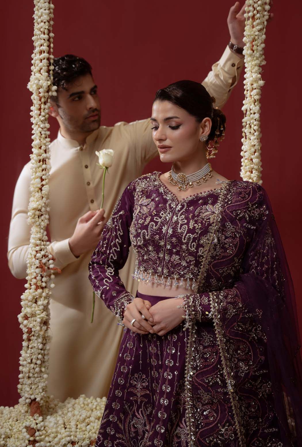 Ethereal in close view, with a white rose held beside the model