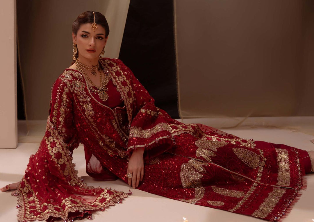 Amour, the model seated on the floor with the dupatta spread around her