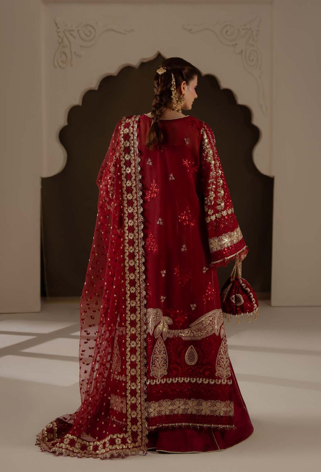 Amour from behind, with gold paisley-shaped motifs at the hem