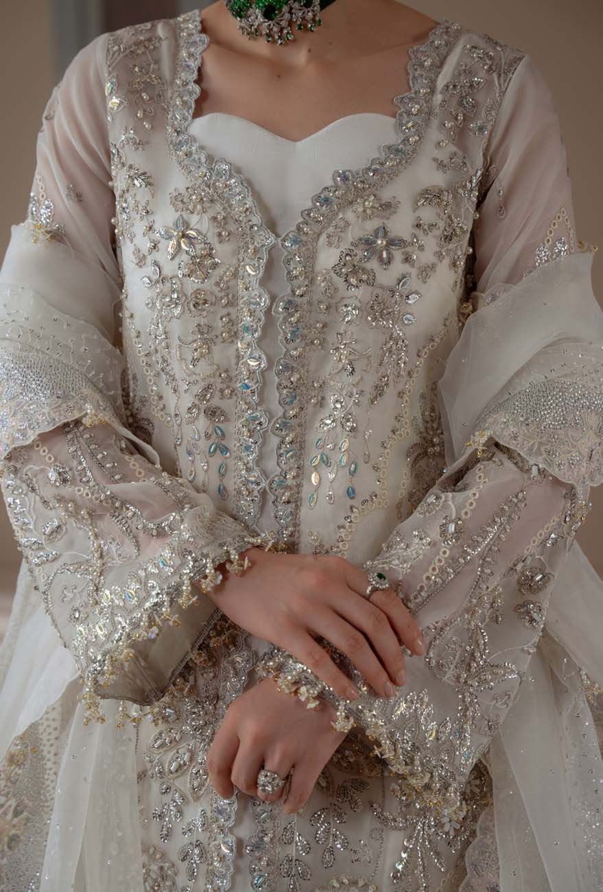 Detail of Serenity's embellished neckline and sleeves